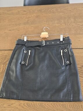 Morgan de Toi Black Faux Leather Mini Skirt with Eyelet Zip Pockets